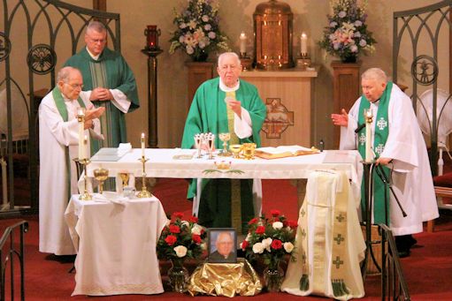 Fr. Frederick Eisemann celebrates Mass in thanksgiving for his 60 years in the priesthood. Concelebrating are Frs. John Reif and Thomas Wheeland, with Dcn. Ed Giblin assisting.